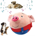 Bouncing squeaky pig plush toy in blue overalls with curious puppy